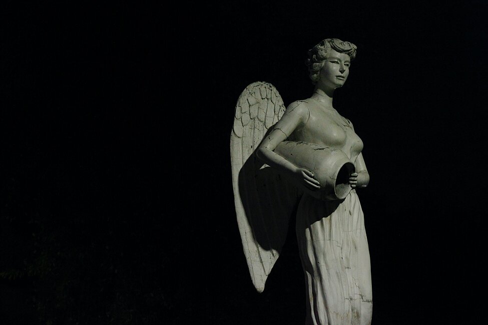 Stone angel on black