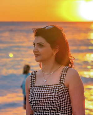 A woman and a sunset.