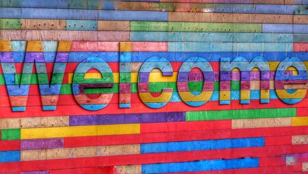 word "Welcome" in rainbow colors