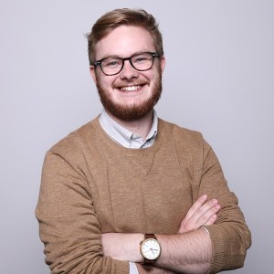 Male in brown sweater